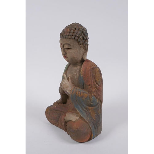 240 - A Sino Tibetan carved and painted wood figure of Buddha, 22cm high