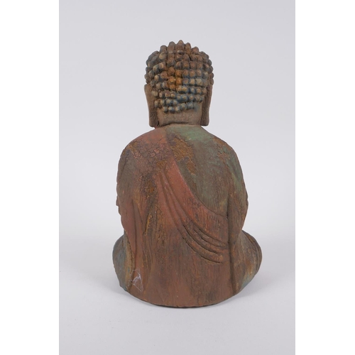 240 - A Sino Tibetan carved and painted wood figure of Buddha, 22cm high