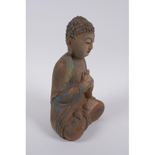 240 - A Sino Tibetan carved and painted wood figure of Buddha, 22cm high