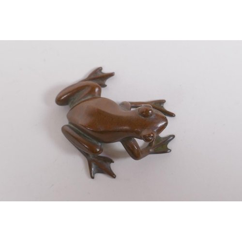 243 - A Japanese style bronze okimono frog, seal mark to base, 5cm long