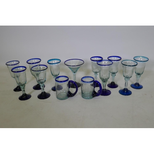 244 - A quantity of hand blown drinking glasses, 19cm high