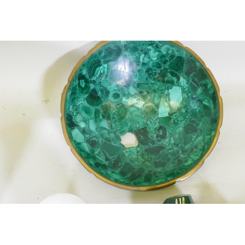 25 - A malachite bowl with brass rim, AF, a malachite ornament/brush rest, a bowl, two geo-odes, an alaba... 