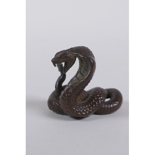 265 - A Japanese style bronze okimono cobra, mark to base, 4cm high