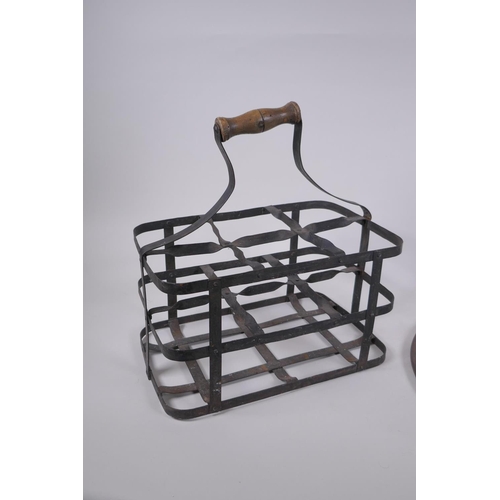 269 - An antique riveted metal six bottle carrier, together with two metal hanging pan holders, carrier 31... 