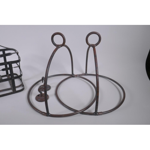 269 - An antique riveted metal six bottle carrier, together with two metal hanging pan holders, carrier 31... 