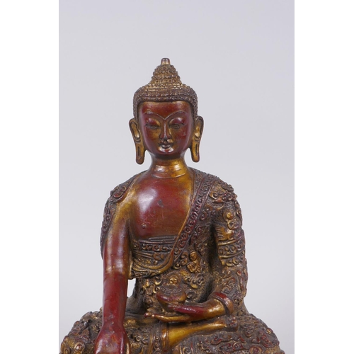 276 - A Sino Tibetan gilt and coppered bronze figure of Buddha, 23cm high