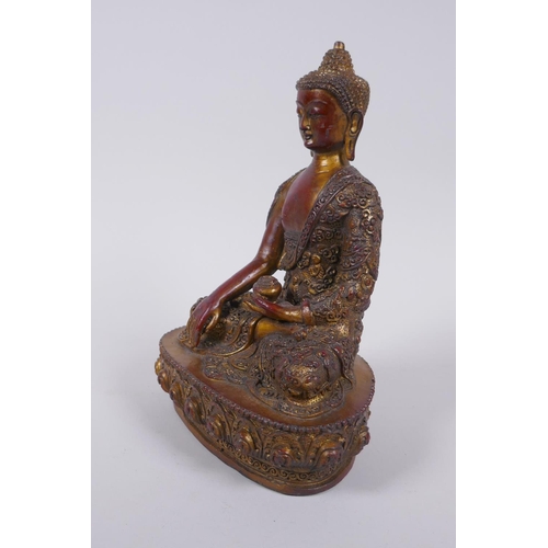 276 - A Sino Tibetan gilt and coppered bronze figure of Buddha, 23cm high