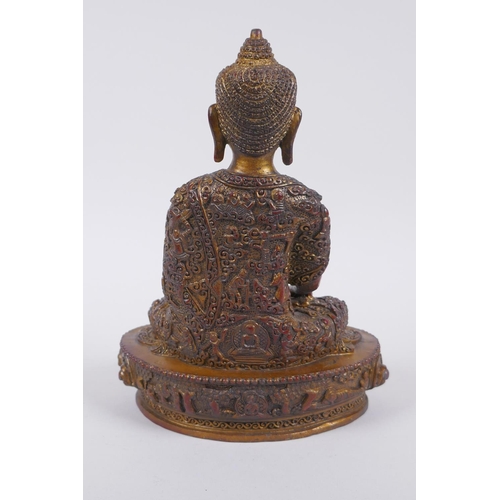 276 - A Sino Tibetan gilt and coppered bronze figure of Buddha, 23cm high