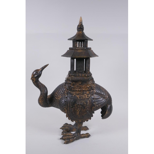 28 - An oriental gilt bronze censer and cover in the form of a crane with a two section pagoda 45cm high