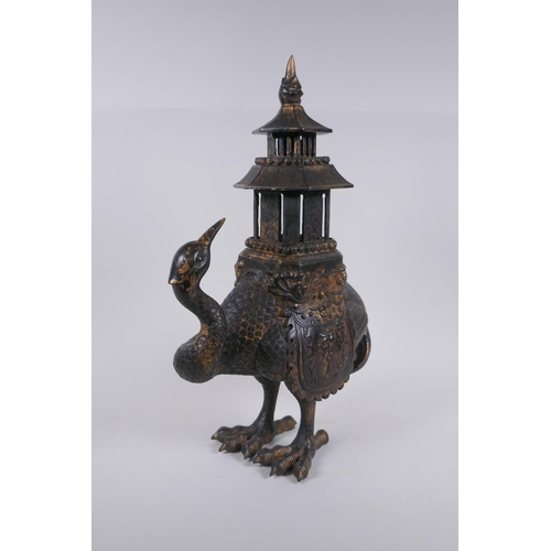 28 - An oriental gilt bronze censer and cover in the form of a crane with a two section pagoda 45cm high