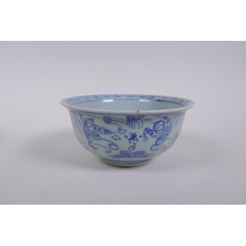 283 - A Chinese blue and white rice bowl decorated with boys flying kites, and a copper glazed rice bowl w... 