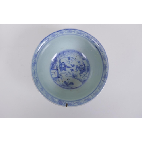 283 - A Chinese blue and white rice bowl decorated with boys flying kites, and a copper glazed rice bowl w... 