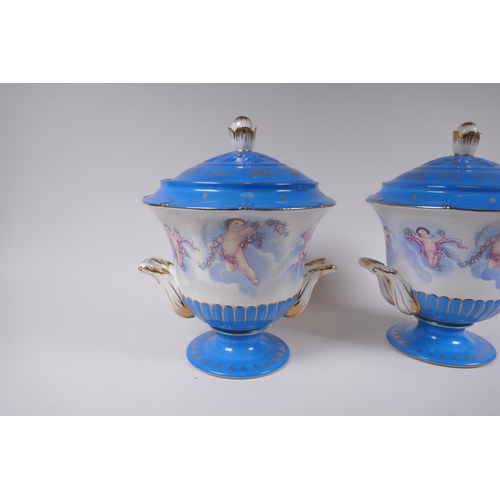 284 - A pair of Sevres style porcelain urns and covers with two handles, decorated with winged putti, 28cm... 