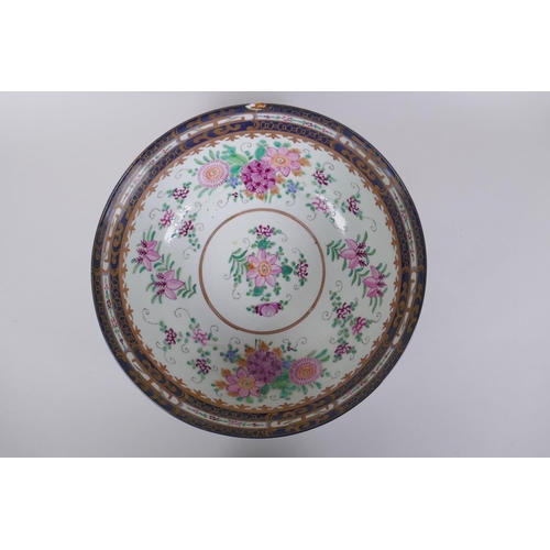 285 - A late C19th/early C20th Chinese export ware punch bowl, the interior decorated with famille rose en... 