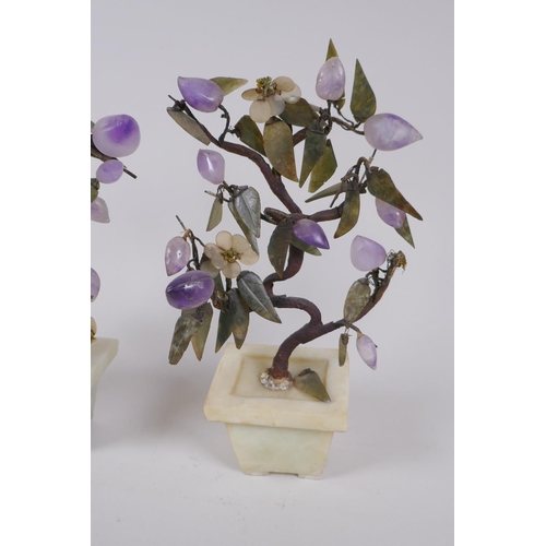 286 - A pair of Chinese ornamental hardstone trees, 23cm high