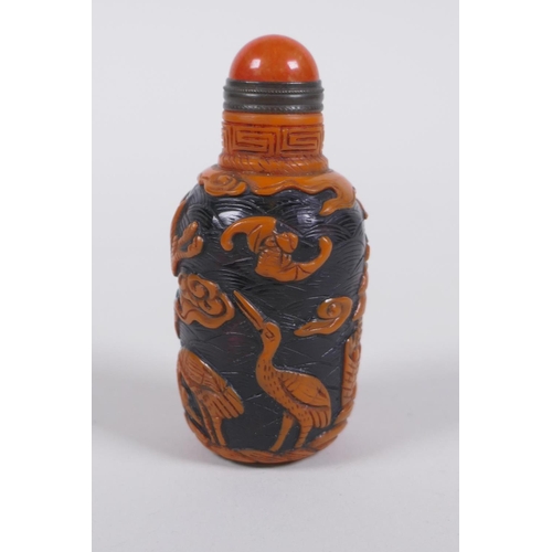 293 - A Chinese Peking glass snuff bottle with raised decoration of crane and bats in a landscape, 7cm hig... 