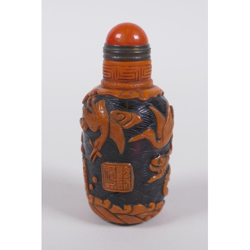 293 - A Chinese Peking glass snuff bottle with raised decoration of crane and bats in a landscape, 7cm hig... 