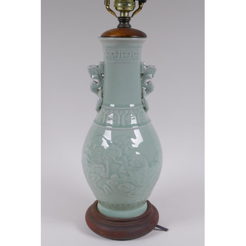 296 - A Chinese celadon glazed porcelain vase with underglaze kylin decoration, converted to a lamp, 56cm ... 