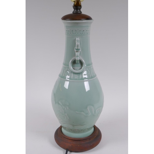 296 - A Chinese celadon glazed porcelain vase with underglaze kylin decoration, converted to a lamp, 56cm ... 