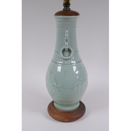 296 - A Chinese celadon glazed porcelain vase with underglaze kylin decoration, converted to a lamp, 56cm ... 