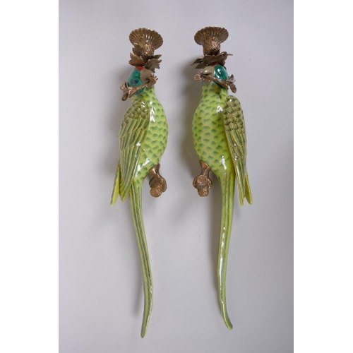 300 - A pair of polychrome porcelain and gilt metal parrot candle sconces, 47cm long