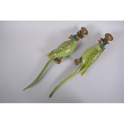 300 - A pair of polychrome porcelain and gilt metal parrot candle sconces, 47cm long