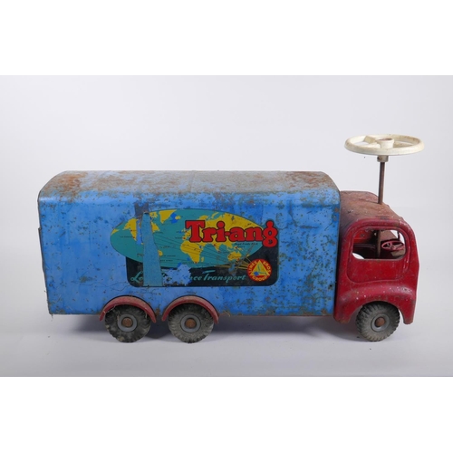 308 - A vintage Triang toys tinplate 'long distance transport' lorry with a sit and steer option, 60cm lon... 