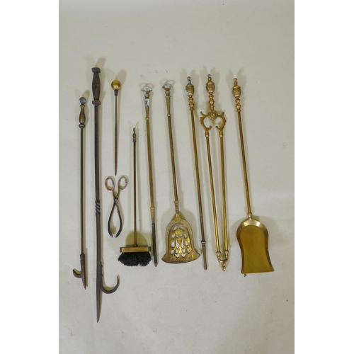 321 - A set of three brass Empire style fire irons and a quantity of other fire irons including a wrought ... 