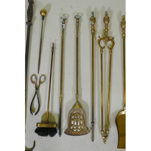 321 - A set of three brass Empire style fire irons and a quantity of other fire irons including a wrought ... 