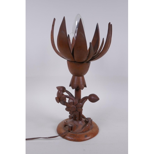 324 - A carved wood lotus flower table lamp, the petals opening to reveal the bulb, 35cm high