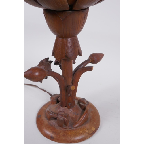 324 - A carved wood lotus flower table lamp, the petals opening to reveal the bulb, 35cm high