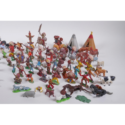 35 - A large quantity of vintage plastic and metal 'cowboy and Indian' toy figures, various makers includ... 