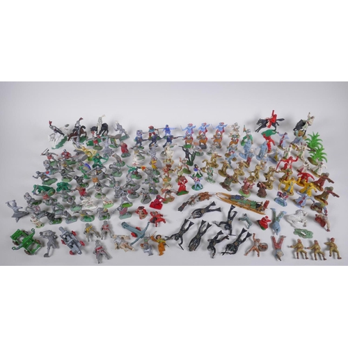 37 - A large quantity of vintage plastic and metal toy soldiers depicting various eras, including medieva... 