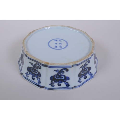 38 - A blue and white porcelain steep sided dish with lobed rim and kylin decoration, Chinese Xuande 6 ch... 
