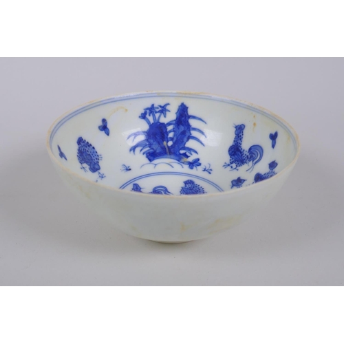 40 - A Chinese blue and white porcelain rice bowl with chicken decoration to the bowl, the exterior with ... 