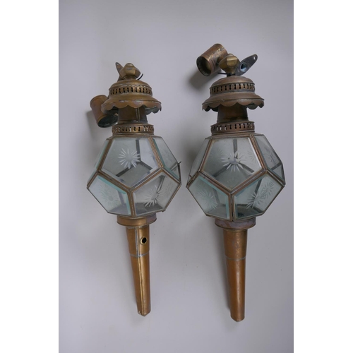 41 - A pair of antique brass and glass polyhedral wall lanterns, 52cm long