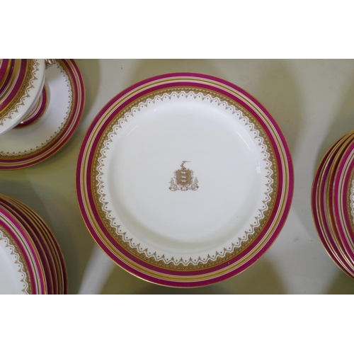 44 - A C19th Royal Worcester Armorial part dinner service bearing the motto Esto Fidelis, and dated 1871 ... 