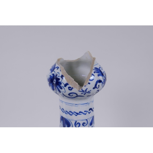 47 - An C18th/C19th Delft blue and white garlic head shaped vase, decorated with birds, flowers and garla... 