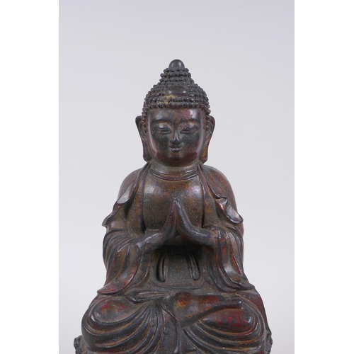 48 - A Chinese bronze figure of Buddha seated on a throne with the remnants of gilt patina, character ins... 