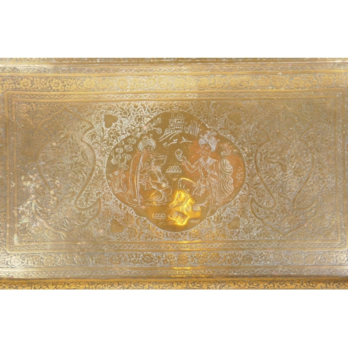 49 - A Persian brass tray with chased decoration depicting Shah Abbas with an attendant, 53 x 32cm