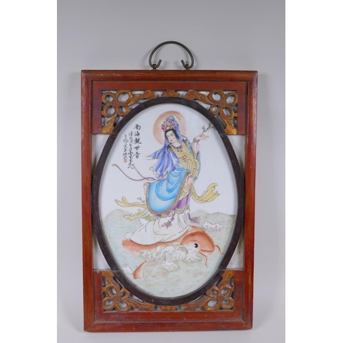 53 - A Chinese republic style polychrome porcelain panel depicting Quan Yin standing on a carp, mounted i... 