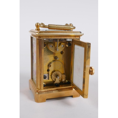 617 - A miniature ormolu and Sevres style porcelain carriage clock, 6cm high