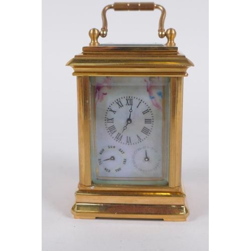 629 - An ormolu and Sevres style porcelain carriage clock with day and date subsidiary dials, 8cm high