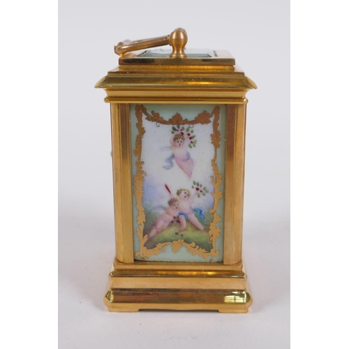 629 - An ormolu and Sevres style porcelain carriage clock with day and date subsidiary dials, 8cm high