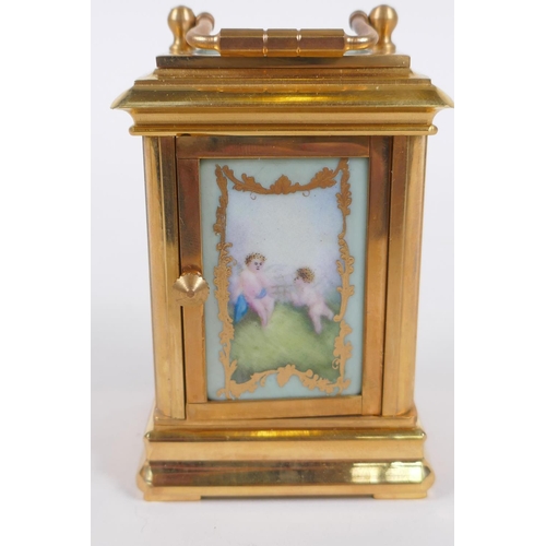 629 - An ormolu and Sevres style porcelain carriage clock with day and date subsidiary dials, 8cm high