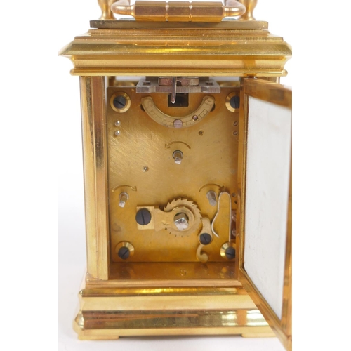 629 - An ormolu and Sevres style porcelain carriage clock with day and date subsidiary dials, 8cm high