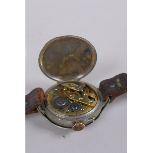 631 - A WWI trench watch, with illuminated Arabic numerals on a shaped white dial with subsidiary second d... 