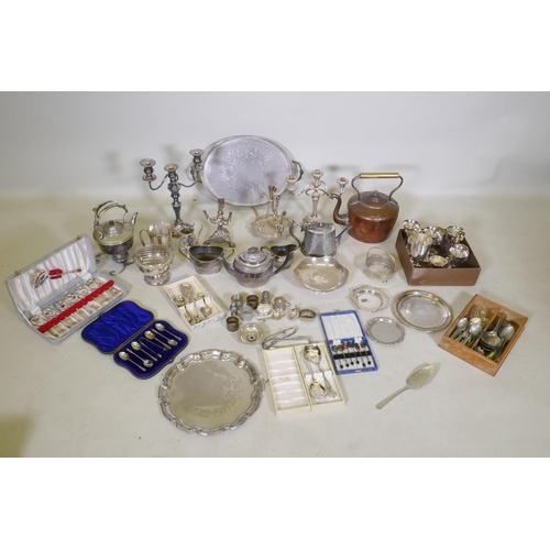 633 - A large quantity of silver plate to include an Elkington teapot, candelabras, flatware, spirit kettl... 