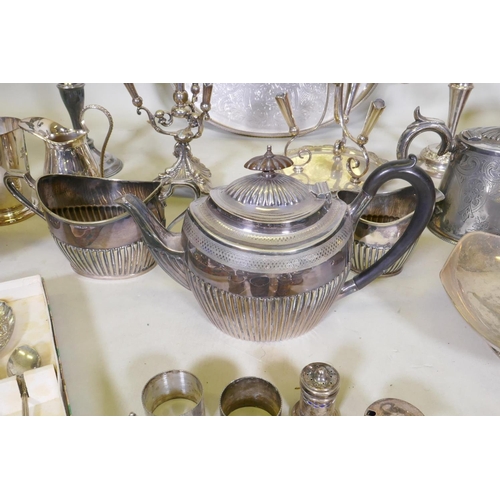 633 - A large quantity of silver plate to include an Elkington teapot, candelabras, flatware, spirit kettl... 