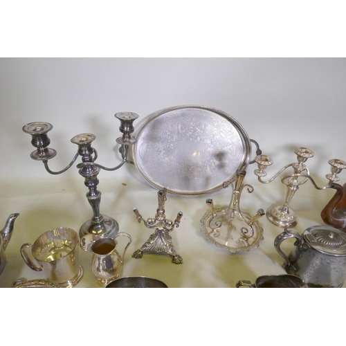 633 - A large quantity of silver plate to include an Elkington teapot, candelabras, flatware, spirit kettl... 